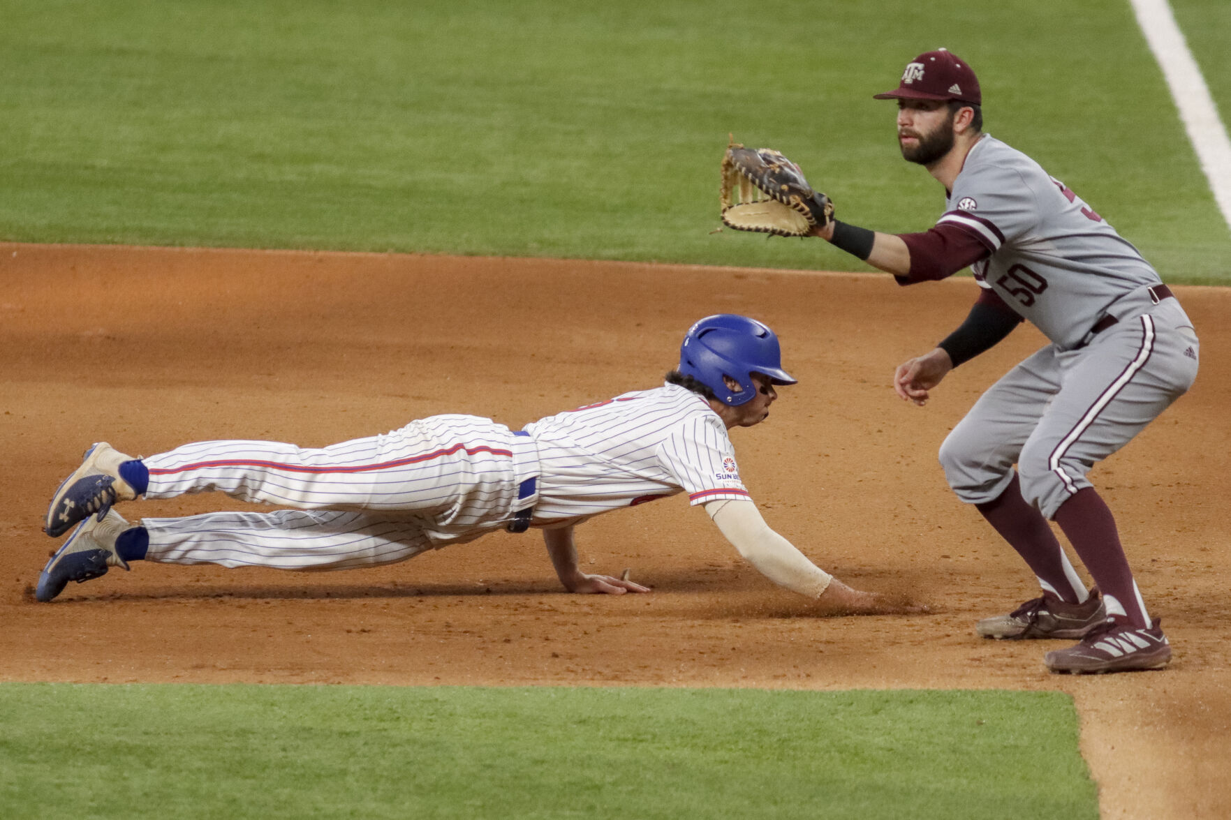 Photos: Mavericks lose 8-4 against Texas A&M University despite early lead